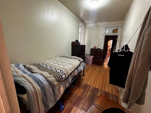 bedroom with wood finished floors