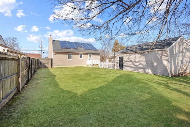 view of yard featuring an outbuilding and a fenced backyard