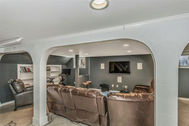 living room with arched walkways, light tile patterned floors, and crown molding