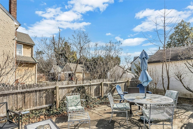 view of patio / terrace featuring outdoor dining space and fence