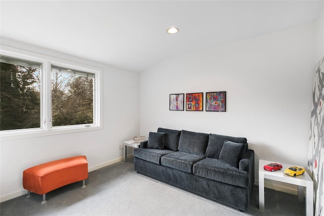 carpeted living area with baseboards and recessed lighting