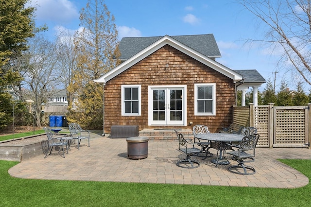 view of patio / terrace featuring french doors and fence