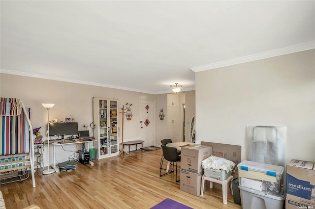 interior space with crown molding and wood finished floors