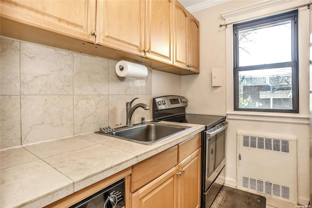 kitchen featuring a sink, stainless steel range with electric cooktop, decorative backsplash, light brown cabinetry, and crown molding