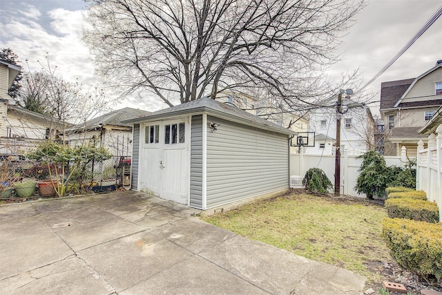 garage with fence