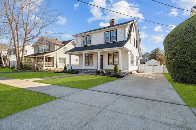 view of front facade with a chimney, a front lawn, a porch, and fence