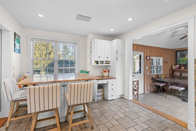 kitchen featuring recessed lighting, backsplash, a ceiling fan, and white cabinetry