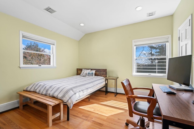 bedroom featuring vaulted ceiling, visible vents, recessed lighting, and wood finished floors