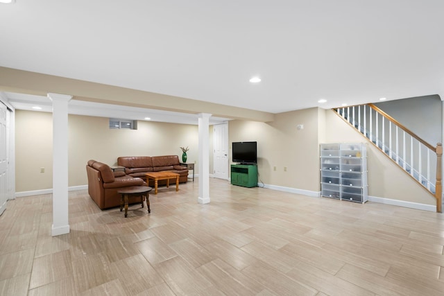 living area with baseboards, ornate columns, light wood finished floors, recessed lighting, and stairs