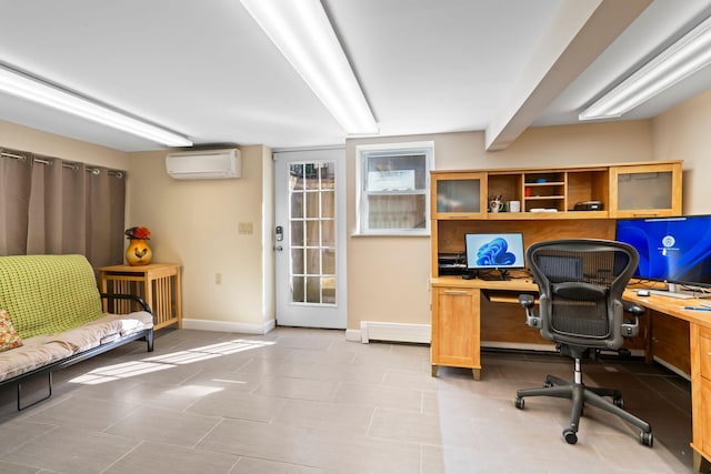 office area featuring baseboards and a wall unit AC