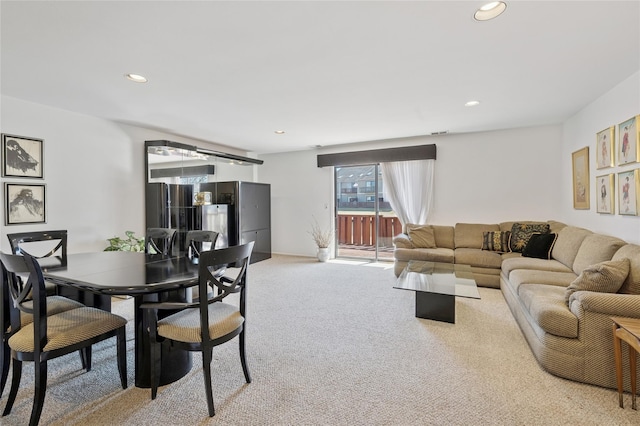 living room with recessed lighting and light colored carpet