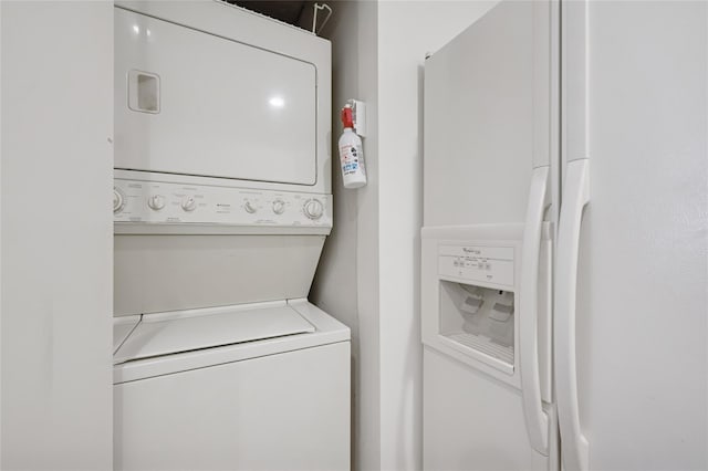 laundry room featuring laundry area and stacked washer and clothes dryer