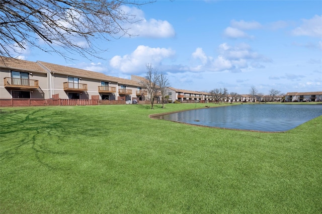 exterior space featuring a residential view and a water view