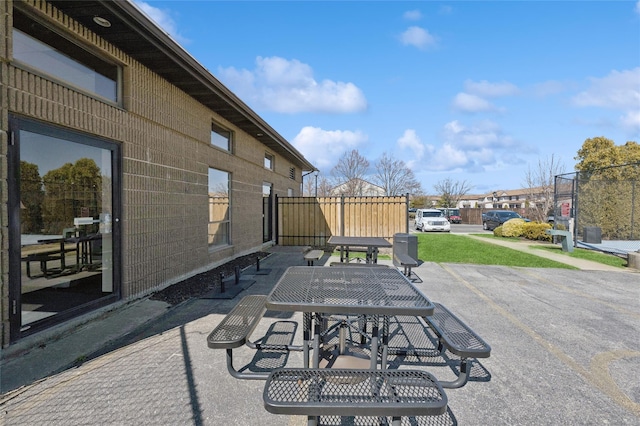 view of patio / terrace with outdoor dining area and fence