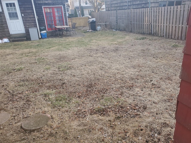 view of yard with a fenced backyard