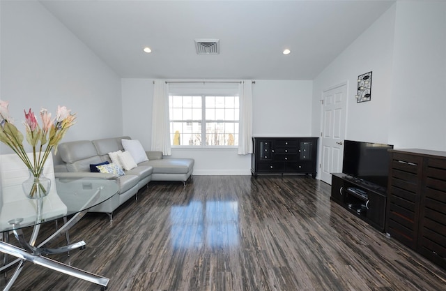 living room featuring recessed lighting, vaulted ceiling, visible vents, and dark wood finished floors