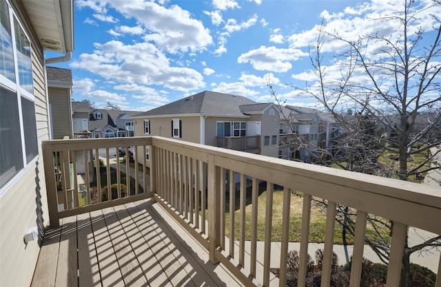 wooden terrace with a residential view