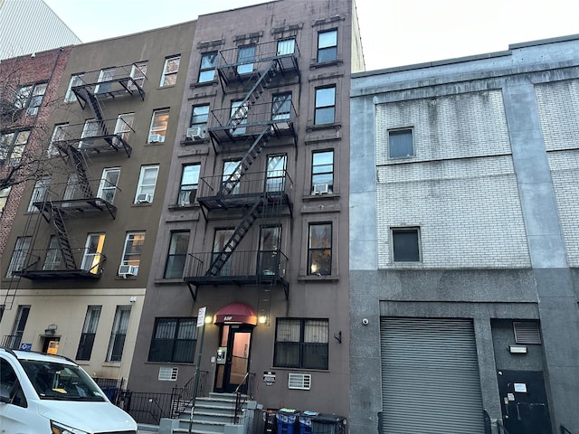 view of property with cooling unit and central air condition unit