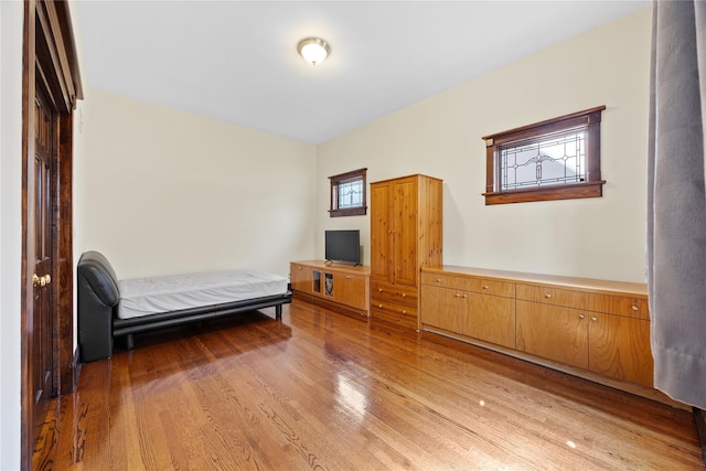 unfurnished bedroom with light wood finished floors