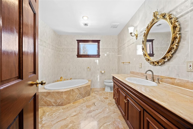 full bath featuring toilet, vanity, visible vents, and tile walls