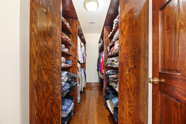 spacious closet featuring visible vents and wood finished floors