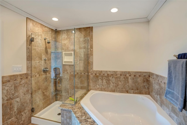 full bath with a shower stall, a bath, crown molding, and recessed lighting