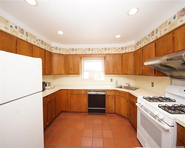 kitchen featuring white appliances, under cabinet range hood, light countertops, and a sink