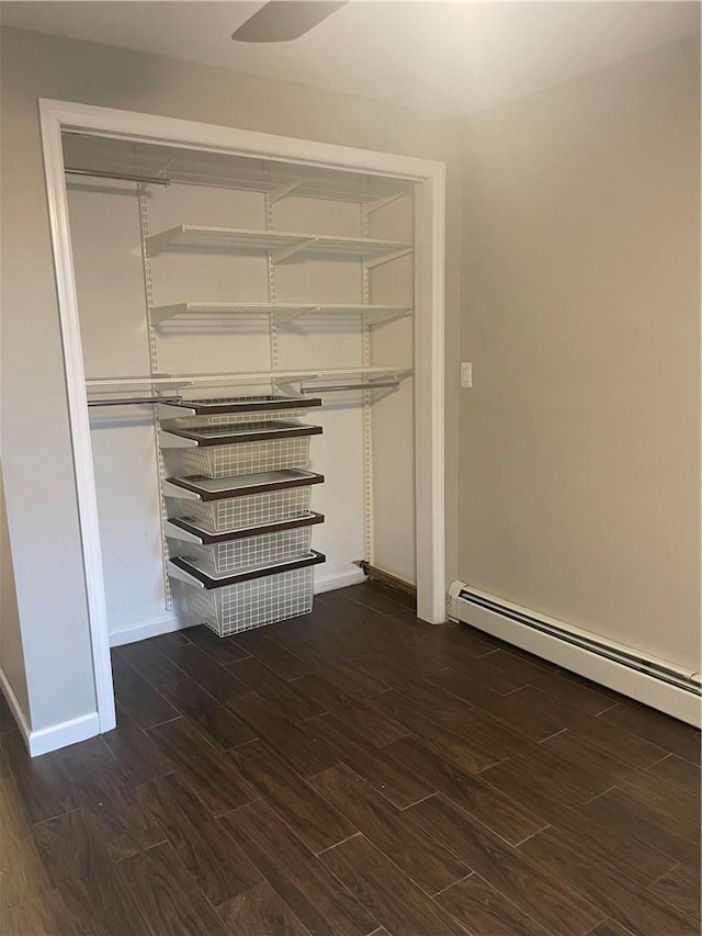 closet featuring baseboard heating