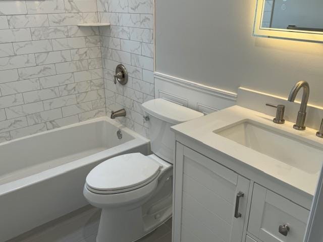 full bathroom with bathtub / shower combination, vanity, and toilet