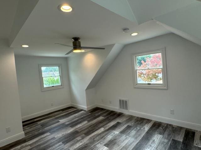 bonus room with baseboards, visible vents, wood finished floors, vaulted ceiling, and recessed lighting