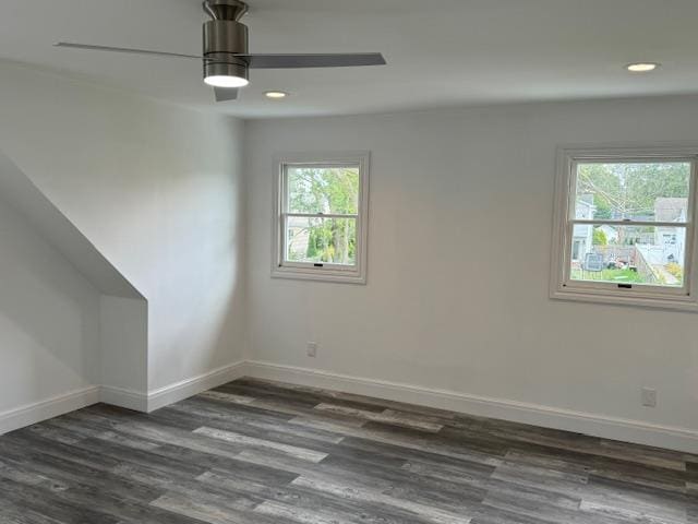 interior space featuring a ceiling fan, baseboards, dark wood-style flooring, and recessed lighting