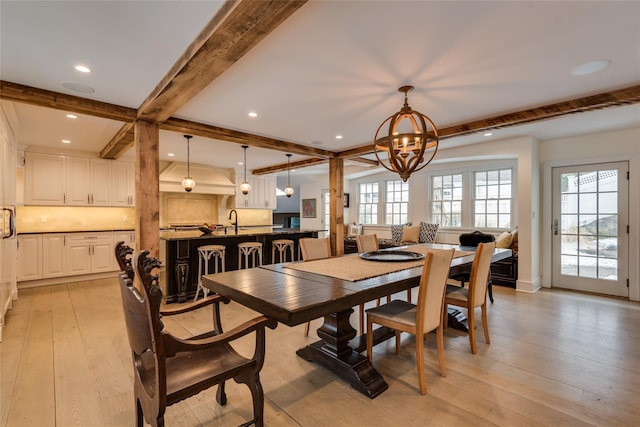 dining room featuring a chandelier, beam ceiling, light wood-type flooring, and recessed lighting