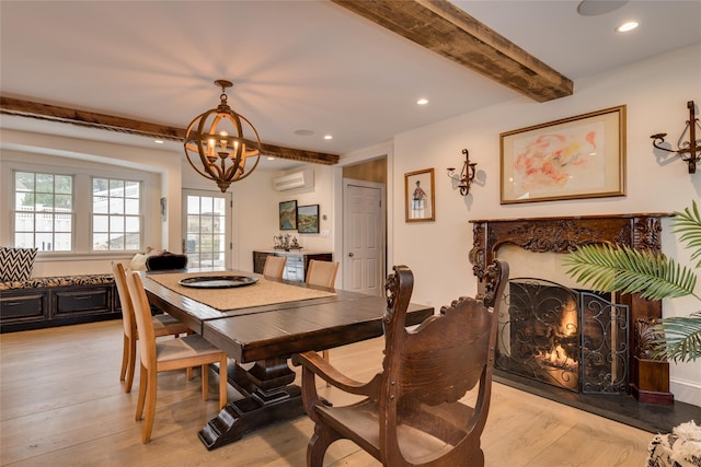 dining area featuring an AC wall unit, beamed ceiling, a chandelier, light wood finished floors, and recessed lighting
