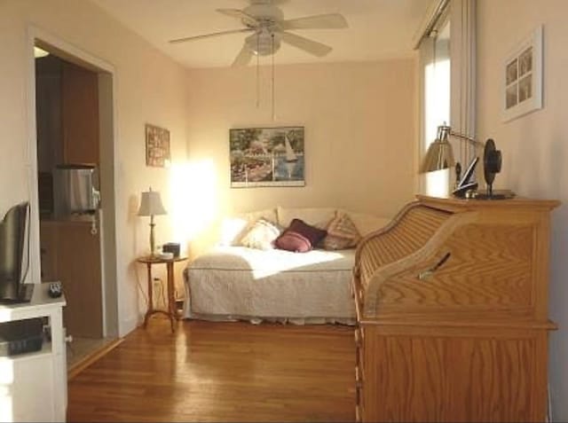 bedroom featuring ceiling fan and wood finished floors