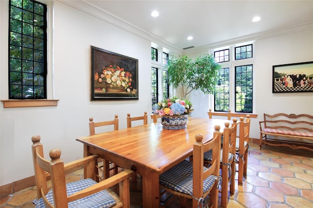 dining room featuring ornamental molding, plenty of natural light, and recessed lighting