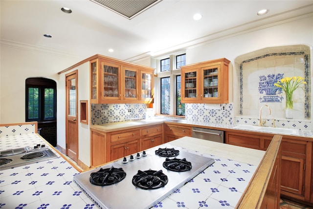 107 Bayview Rd, Manhasset, NY 11030 - kitchen with a sink, appliances with stainless steel finishes, ornamental molding, recessed lighting, and backsplash