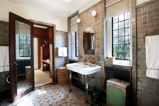 107 Bayview Rd, Manhasset, NY 11030 - bathroom with tile walls and plenty of natural light