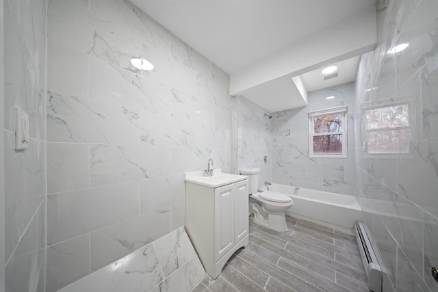 full bathroom featuring shower / bath combination, toilet, a baseboard radiator, vanity, and tile walls