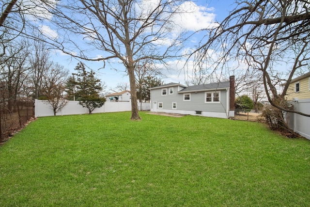 view of yard featuring a patio area and a fenced backyard