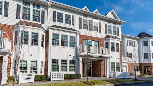 view of front of house with a residential view and brick siding