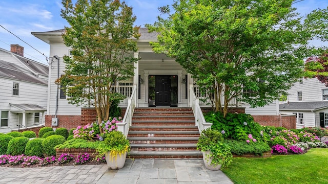 view of front of home with a shingled roof