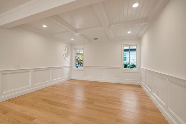 unfurnished room with light wood finished floors, visible vents, coffered ceiling, beam ceiling, and recessed lighting