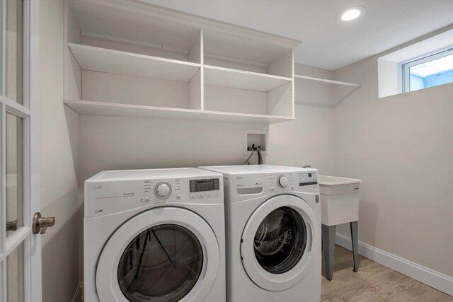 washroom with laundry area, baseboards, light wood-style flooring, washer and dryer, and recessed lighting