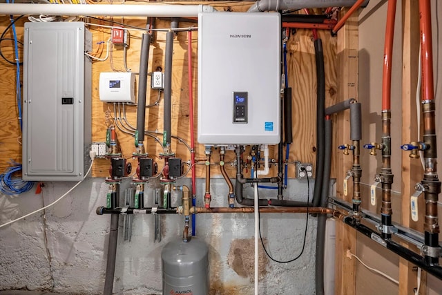 utility room with water heater and electric panel