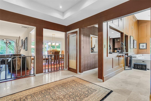 hall with recessed lighting and visible vents