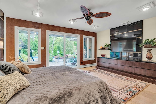 bedroom featuring a baseboard radiator, access to outside, visible vents, and ceiling fan