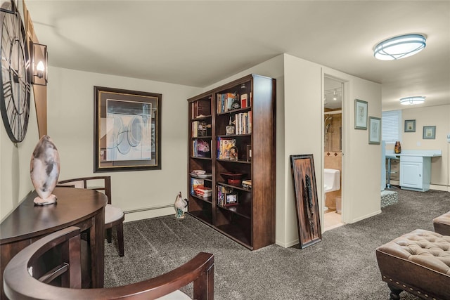 living area featuring carpet and baseboard heating