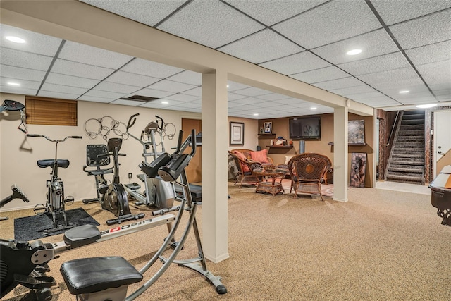 exercise room featuring a drop ceiling and recessed lighting