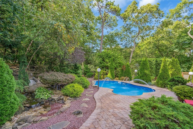 outdoor pool featuring a patio