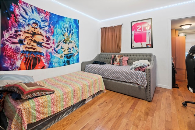 bedroom featuring wood finished floors